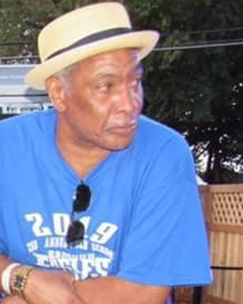 Wayne, straw hat, in profile