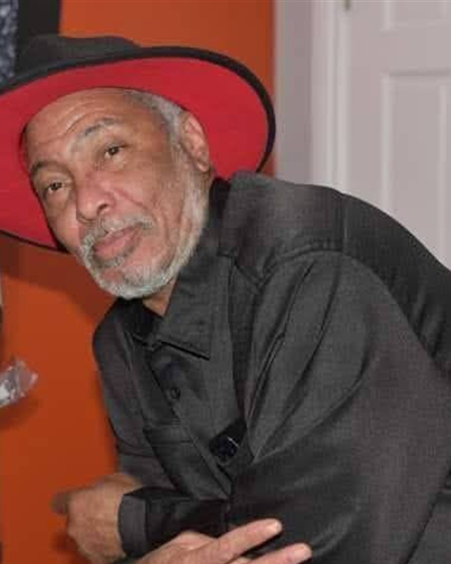 Wayne, red wide-brim hat, black satin shirt